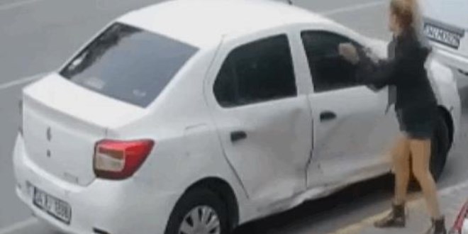 Tartıştığı eşinin aracını parçaladı