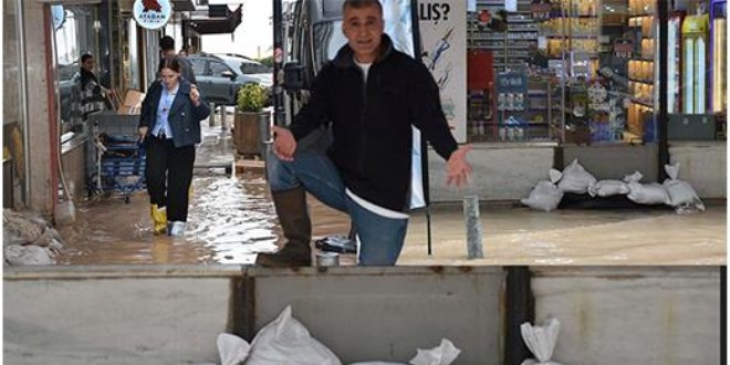 Yağmur devam ediyor, esnaf kum torbalı önlem aldı