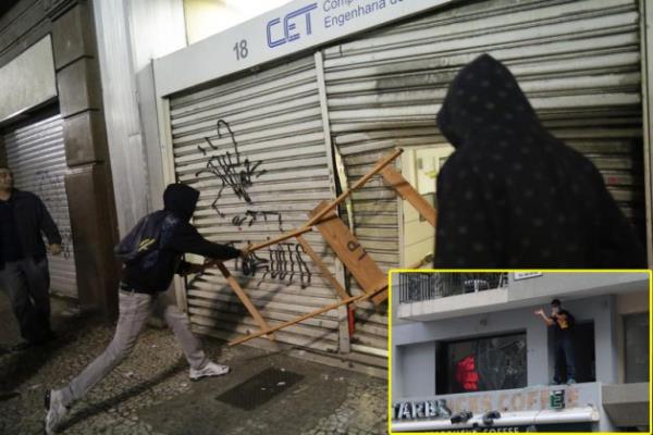 Taksim'de çok sayıda dükkan ve mağazanın camları kırılmış kepenkleri sprey boyalarla boyanmıştı.