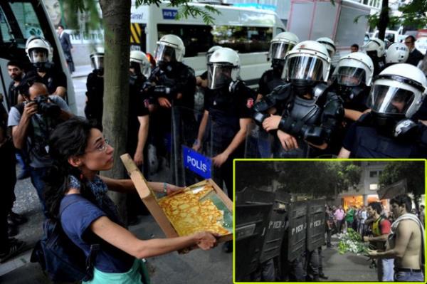 Gezi Parkı olaylarında göstericiler polise börek ikram ederken, Brezilya'da ise çiçek verdi