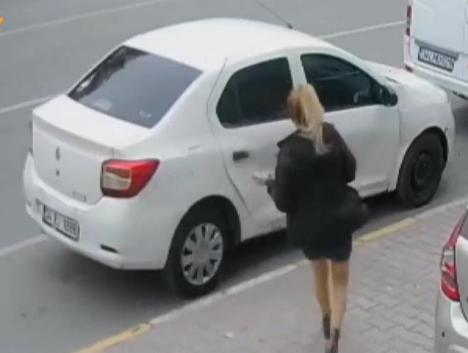 stanbul Esenyurt'ta bir kadn tartt einin aracn paralad.