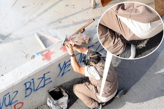 <b>Polise havai fi�ek d�zene�i ile sald�ran ki�inin belindeki kabar�kl�k dikkat �ekti. Sosyal medyada beldeki cismin silah oldu�u iddia edildi.</b>