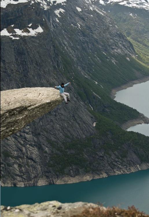 5) Sitting on the Trolltunga rock in Norway.