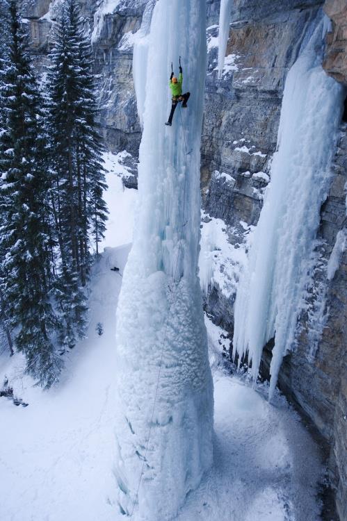 8) Ice climbing a frozen waterfall.