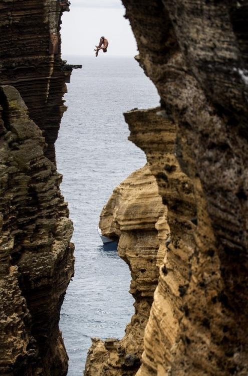 16) Blake Aldridge dives 29 meters from the rock monolith during the Red Bull Cliff Diving World Series in Portugal.