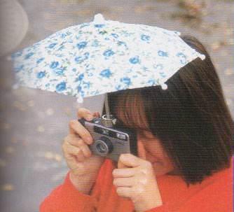 Yamurlu havalarda fotoraf makinenizi koruyan emsiye...